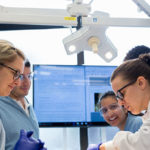 Group of students working hands-on in a lab