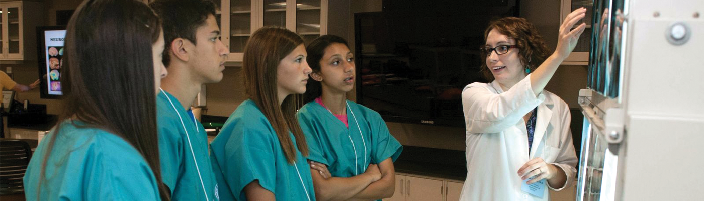 Students viewing x-rays with faculty