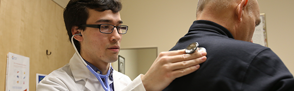 Student working with a patient