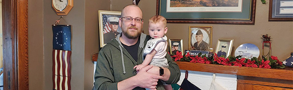 Fred Hutson Holding Baby