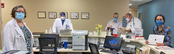 Five volunteers gather at the Student-Run Free Clinic at NEOMED