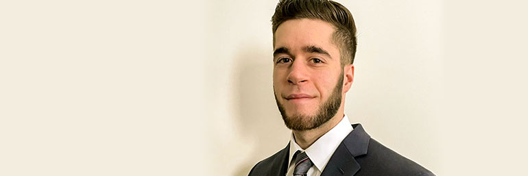 Rising first-year College of Medicine student Joseph Kessler in a coat and tie.