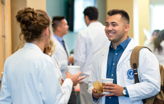 Transfer students at NEOMED in Rootstown, Ohio, chat during an orientation session.