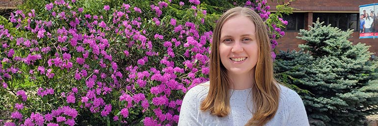 Victoria Wobser, First Graduate of NEOMED’s Accelerated Program in Family Medicine, near a garden.